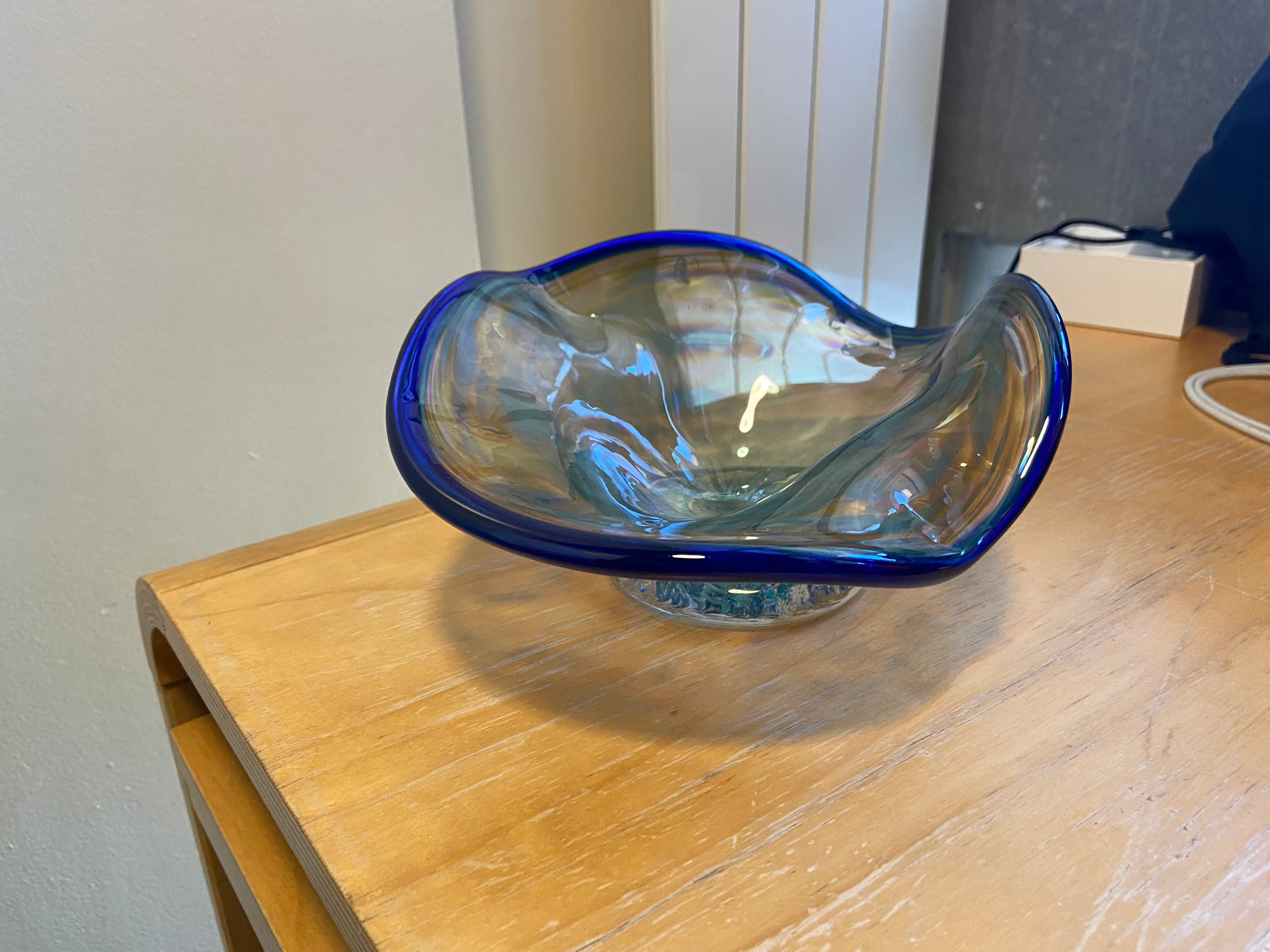 A ruffle bowl with a blue lip wrap